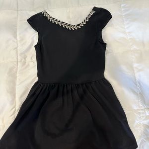 Black short dress with jewels on neck by Chelsea and Violet